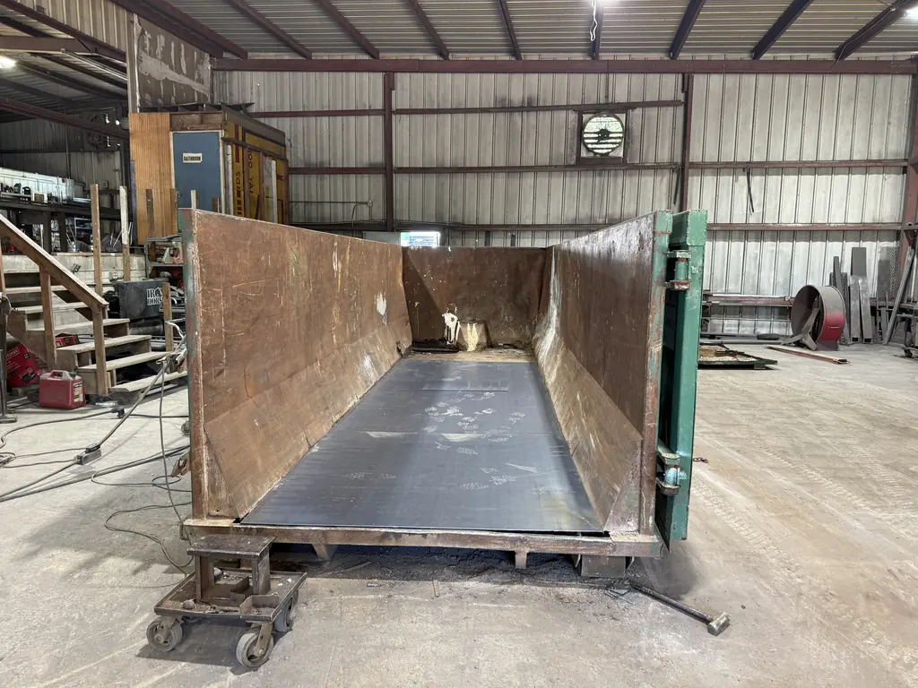 Roll-off container with a new steel floor installed during container floor repair at the NFC shop in Ocala