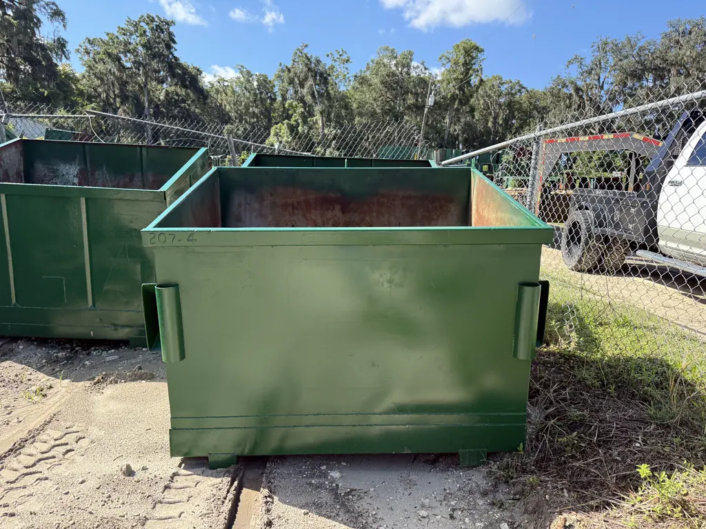 After: front-load dumpster fully repaired and repainted, ready for delivery from the NFC shop in Ocala FL