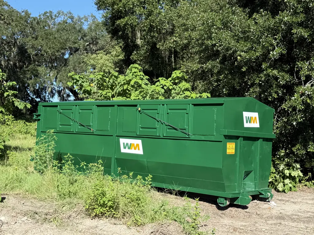 Fully refurbished and repainted 40-yard roll-off container with new decals after roll-off container repair at NFC in Ocala FL